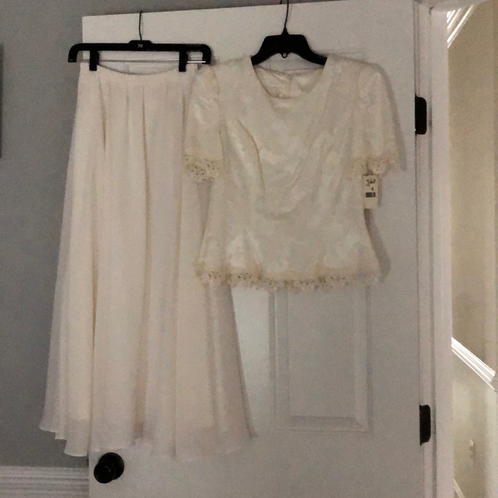 Two piece white/cream formal. Skirt is 34 in long.